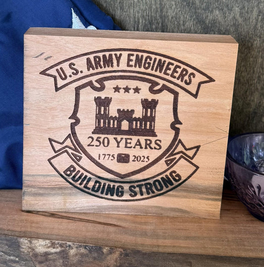 Wooden plaque with U.S. Army Engineers engraving on a wooden surface